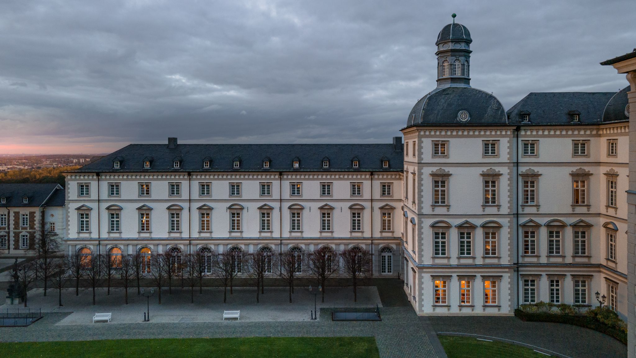 Side view of Althoff Grandhotel Schloss Bensberg in Bergisch Gladbach with sunset