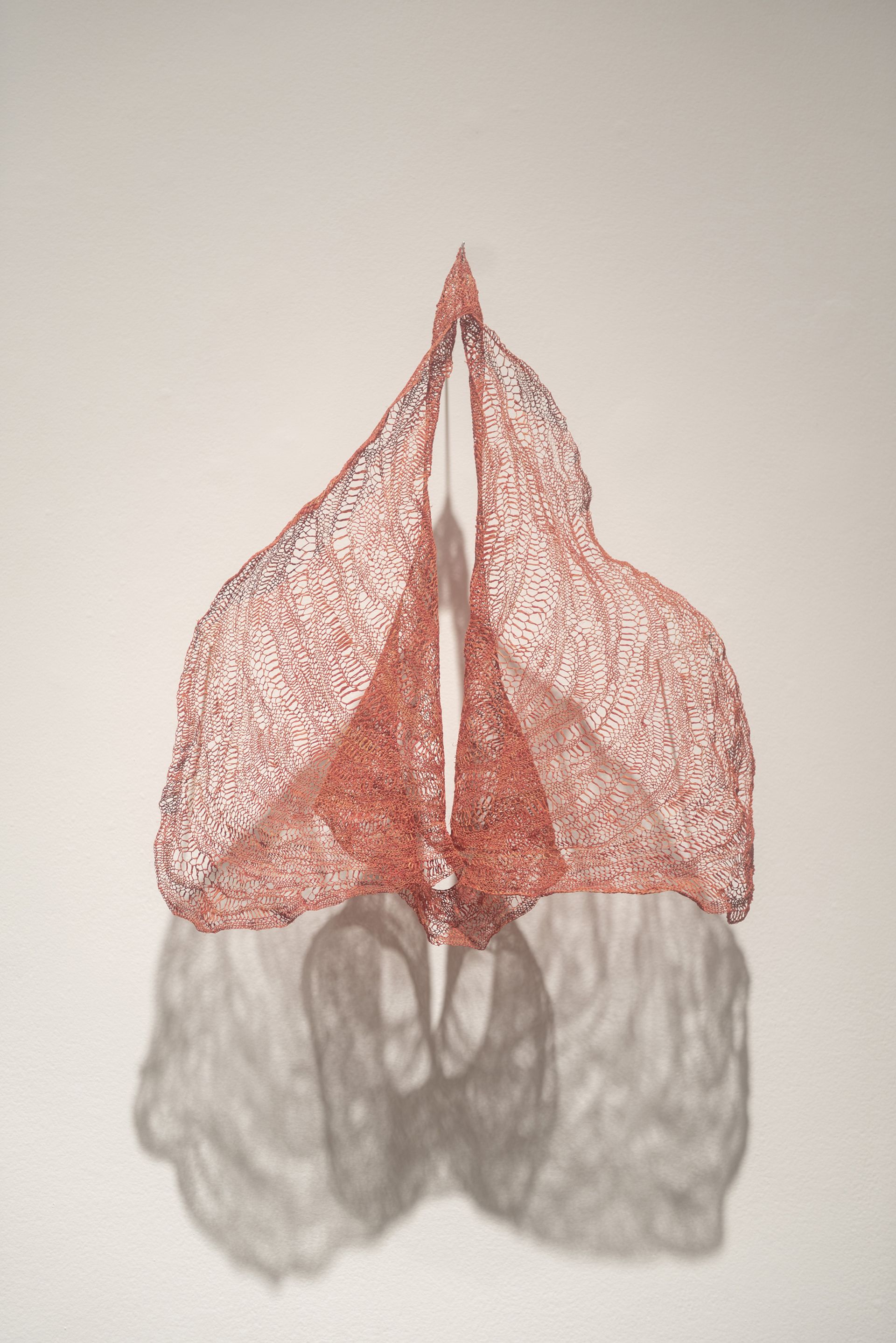 Cristina Flores Pescorán's sculpture, made of dyed raffia and natural plants, explores women's self-perception and their own bodies