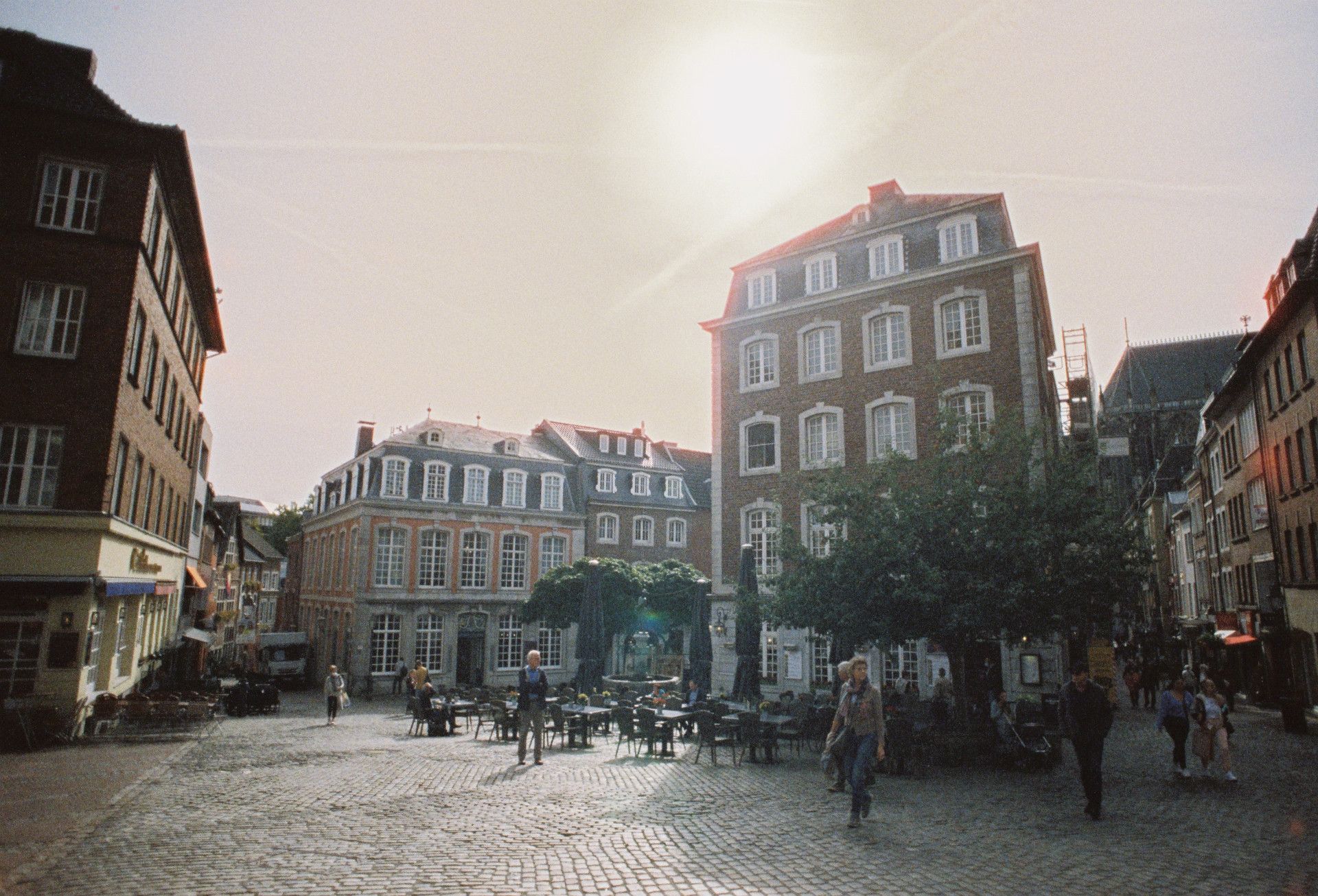 Historic buildings in Aachen's Old Town on a sunny day.