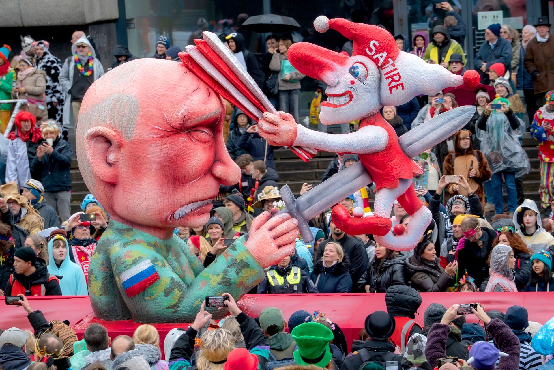 Freedom and humor cannot be suppressed: While the Russian president grimaces in pain, the impaled satirical jester continues to laugh merrily