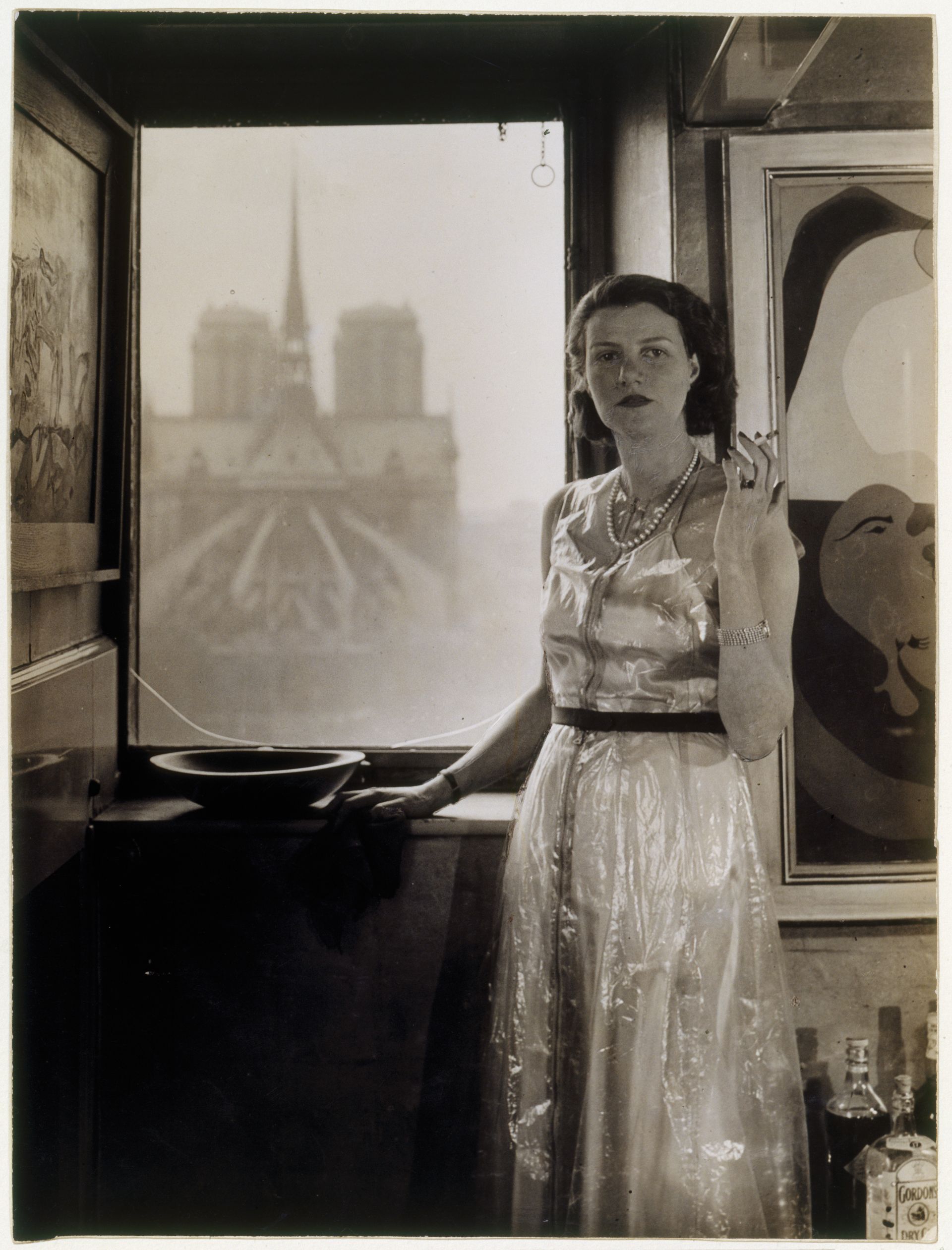 Rogi André, Peggy Guggenheim in front of her apartment window, circa 1935