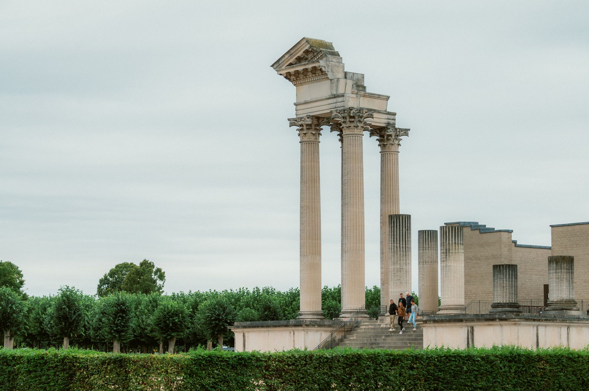 Visitors walk down a flight of stairs in the Harbor Temple