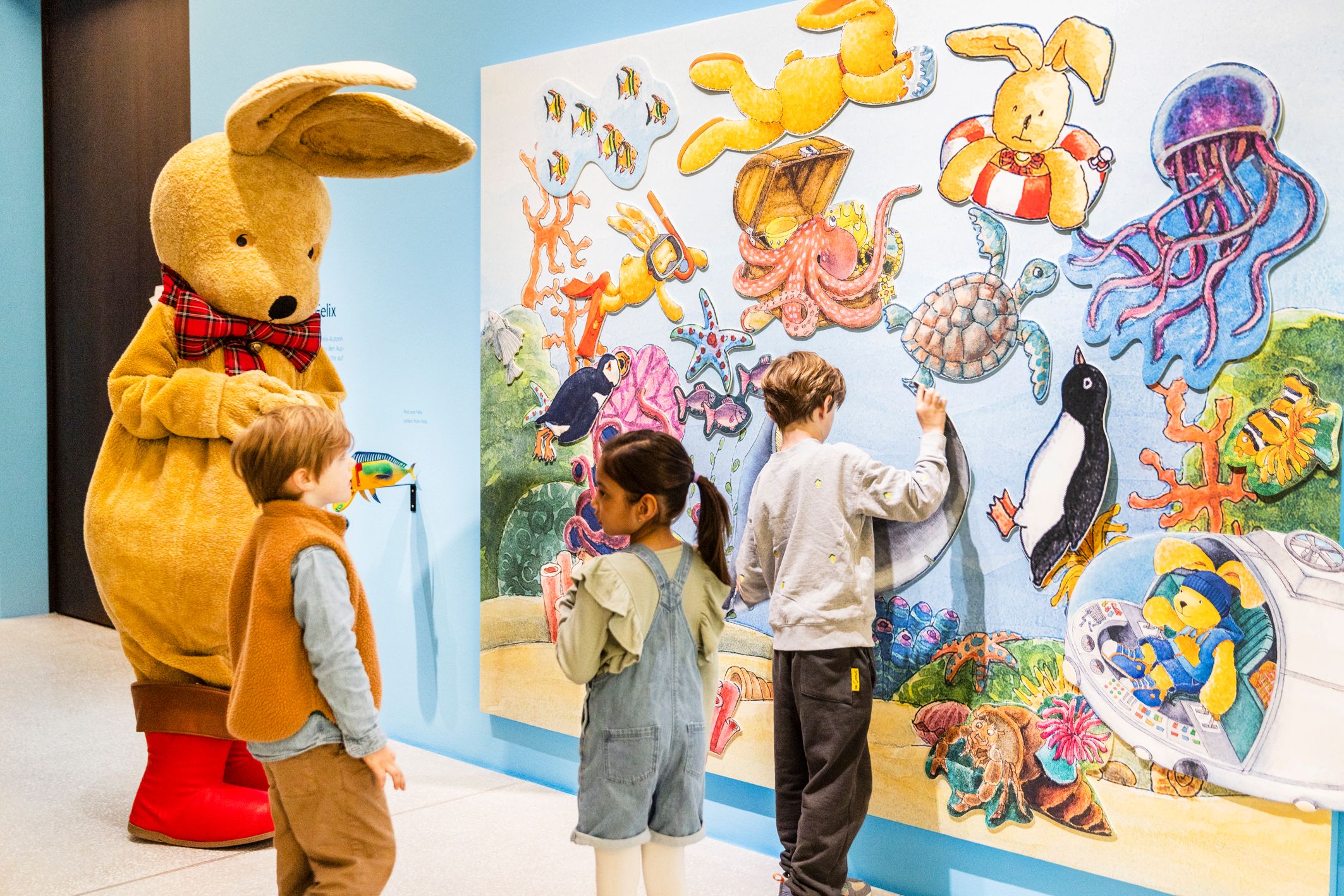 Felix and children in the exhibition