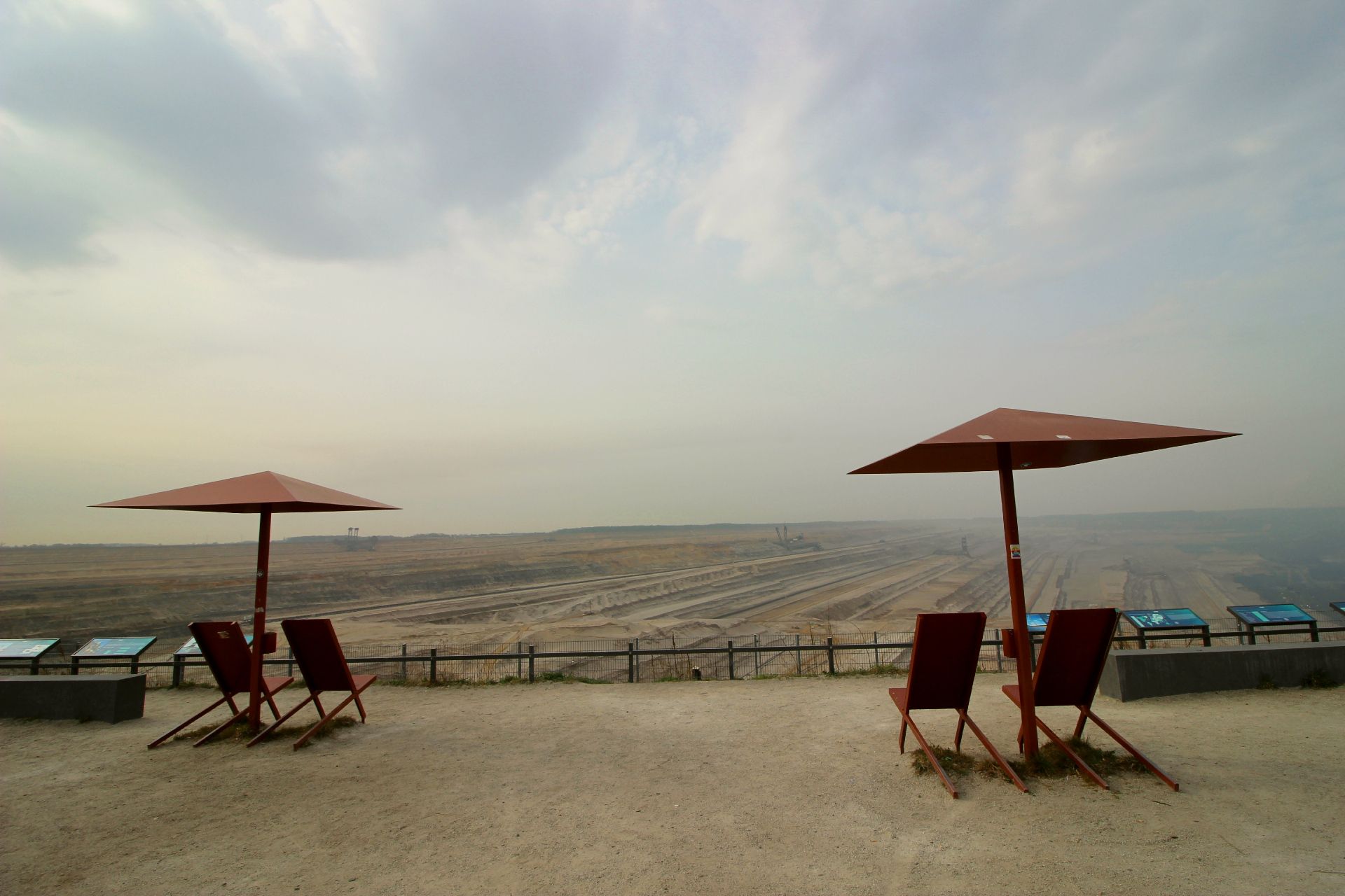 Terra Nova provides deeper insights into open-cast mining, where you can sit on red chairs under red umbrellas