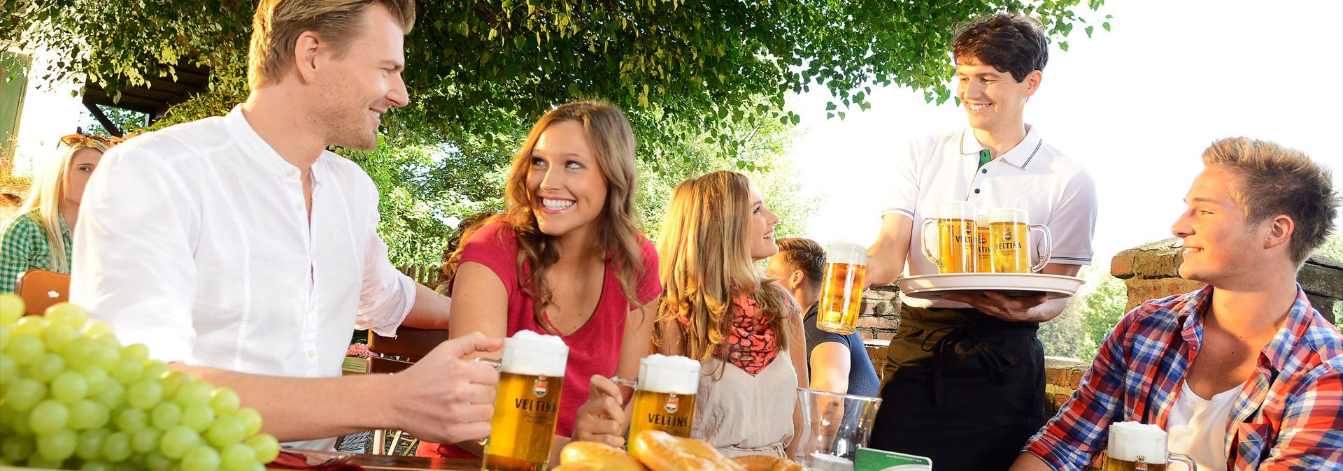 Social get-together in the beer garden at the Veltins brewery
