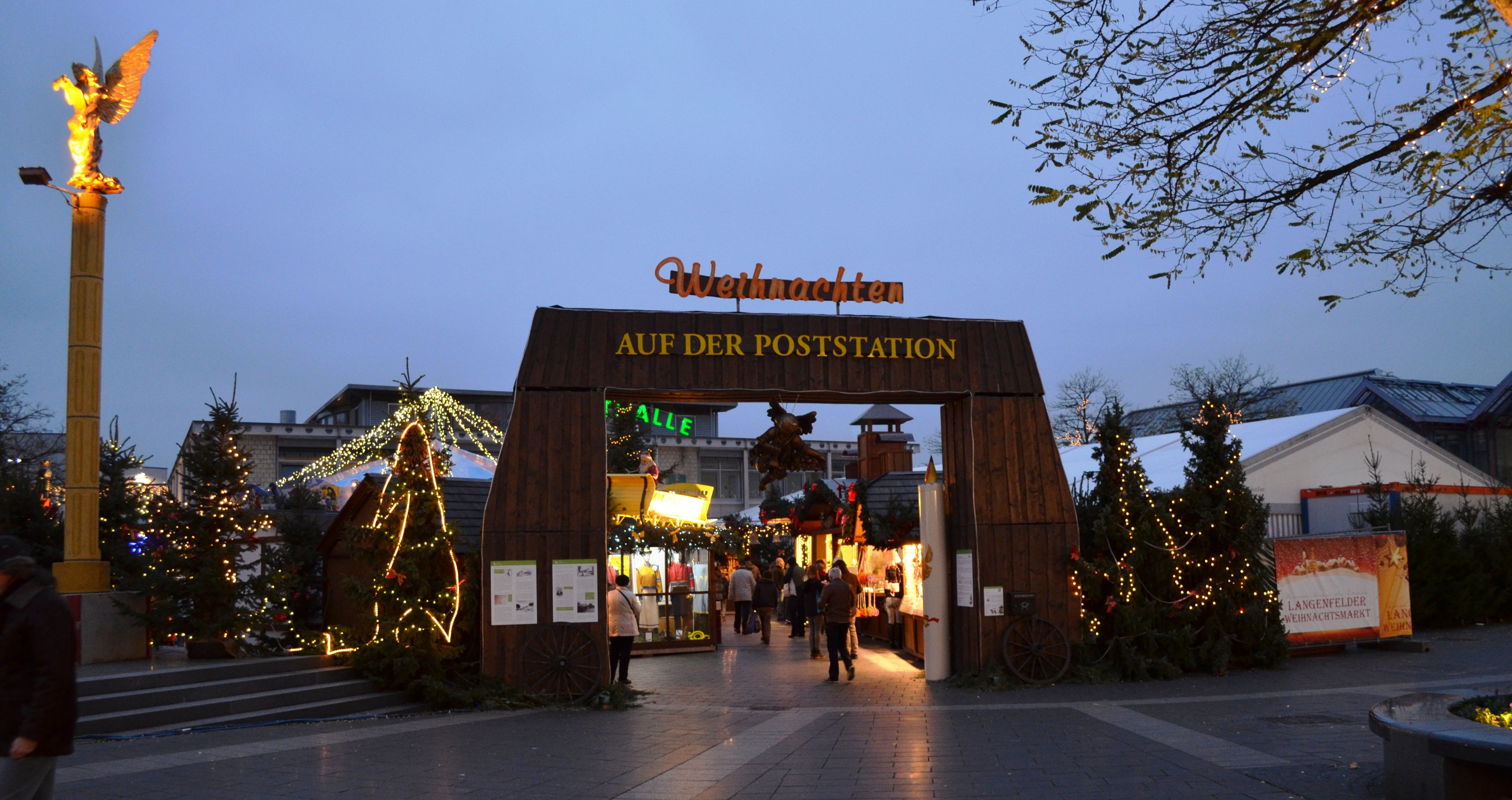 Entrance to the Langenfeld Christmas village, decorated with lights and Christmas decorations.