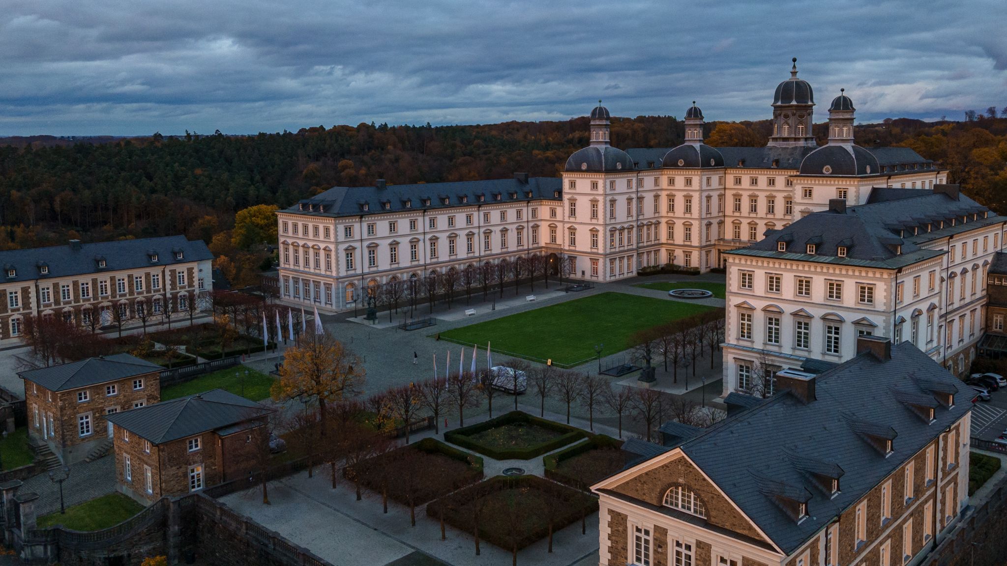 Drone shot of the Grandhotel Schloss Bensberg in the evening sun