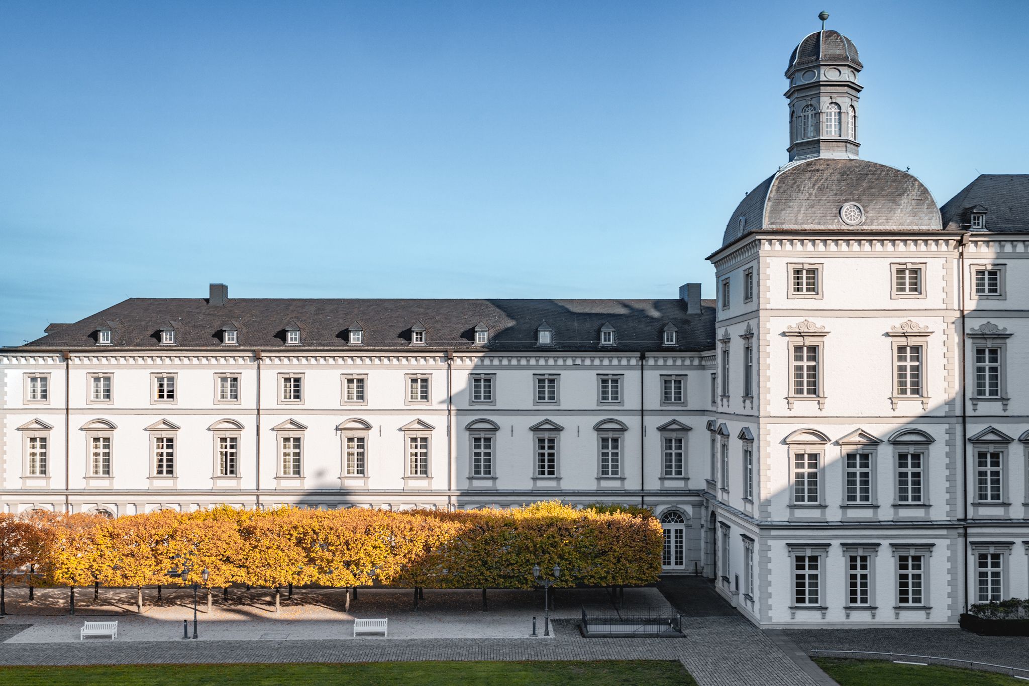 Exterior view of the Grandhotel Schloss Bensberg in the fall