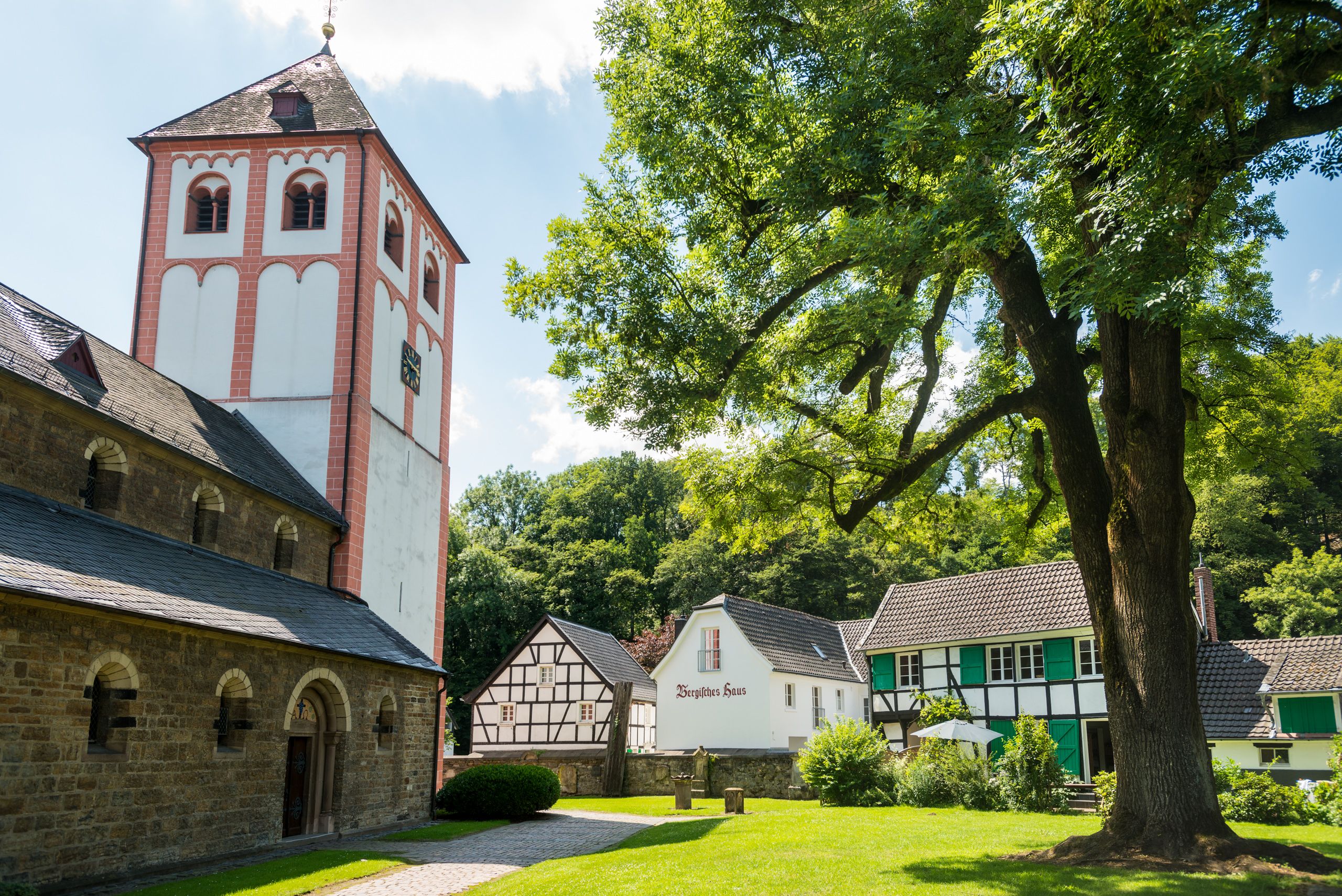 Church with tower and half-timbered houses in Odenthal.