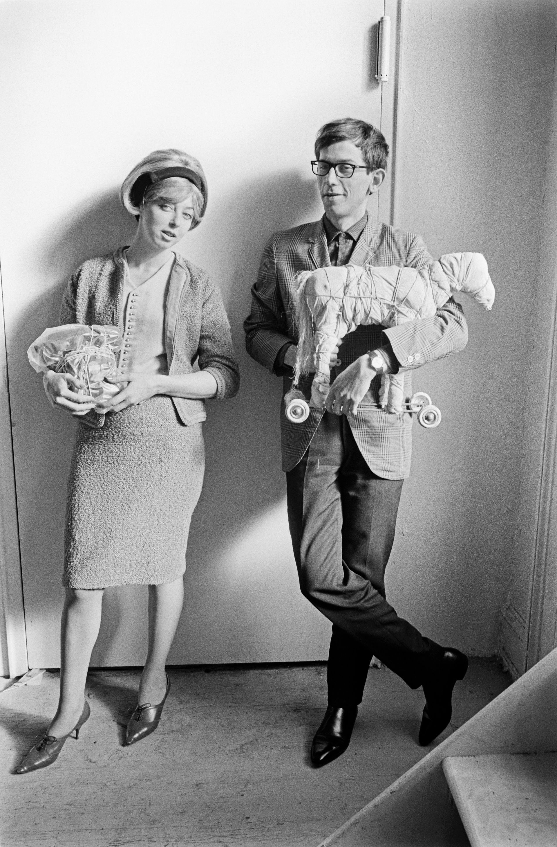 Christo and Jeanne-Claude with the wrapped telephone (1964) and the wrapped toy horse (1963), New York City, 1965