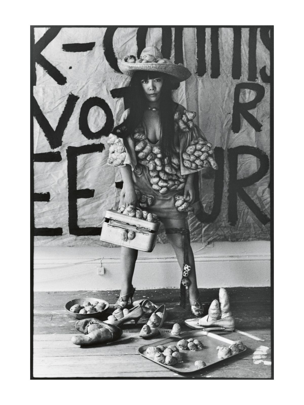 Yayoi Kusama poses in Untitled (Dress) with her Phallic Sculptures in her New York studio, 1971, photo: Tom Haar