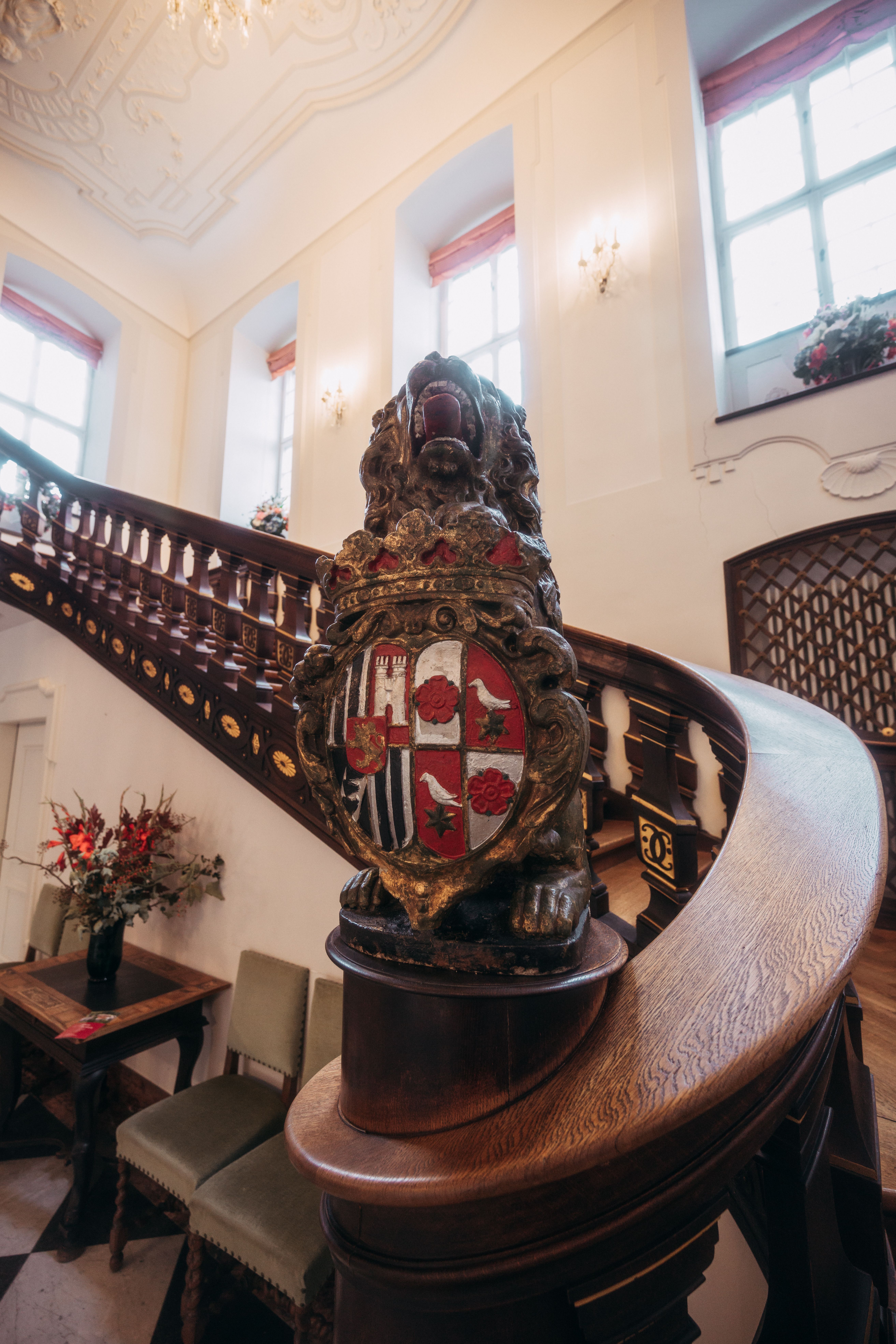 In the staircase of Berleburg Castle, an artistically designed banister leads to the top.