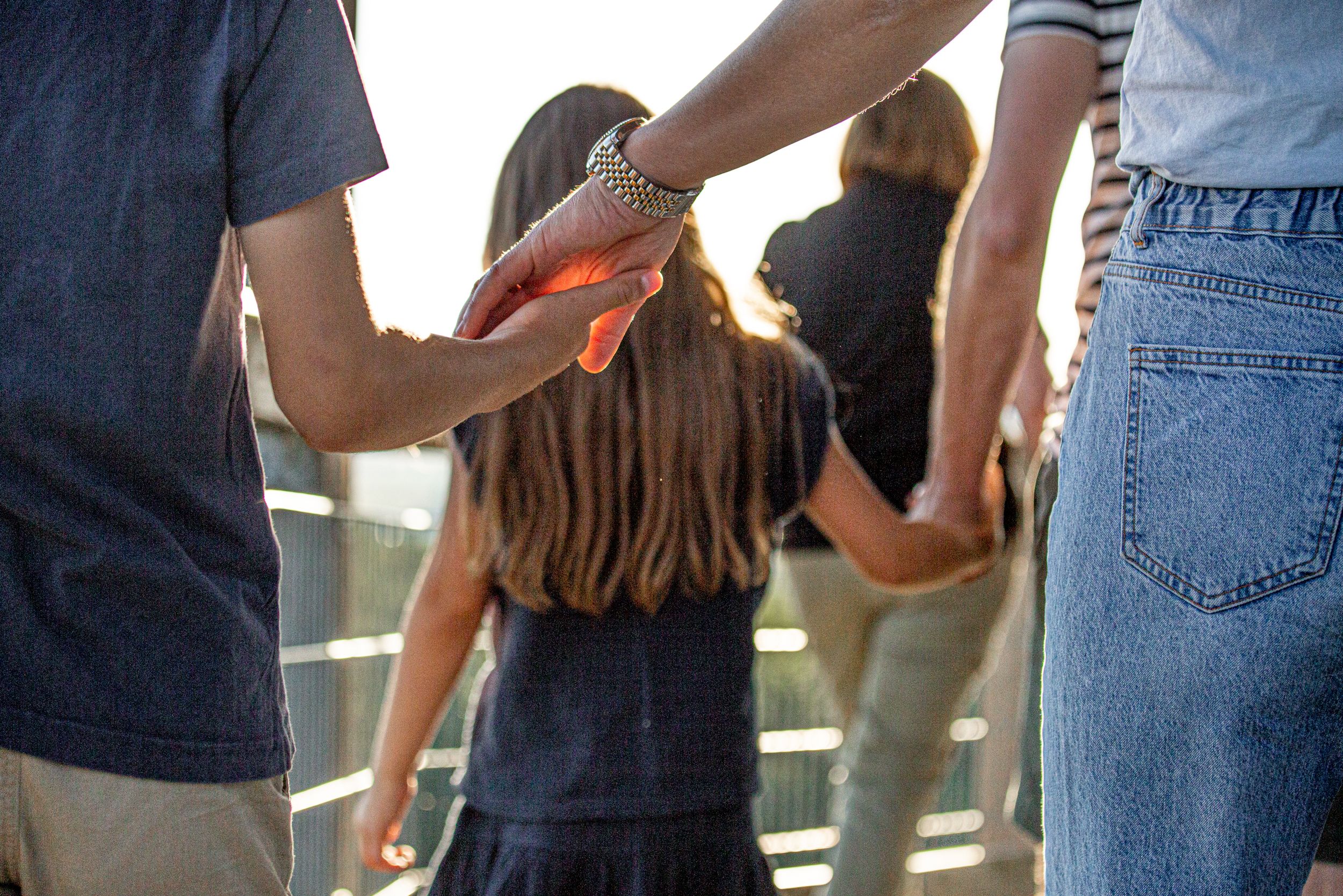 Mother and child holding hands