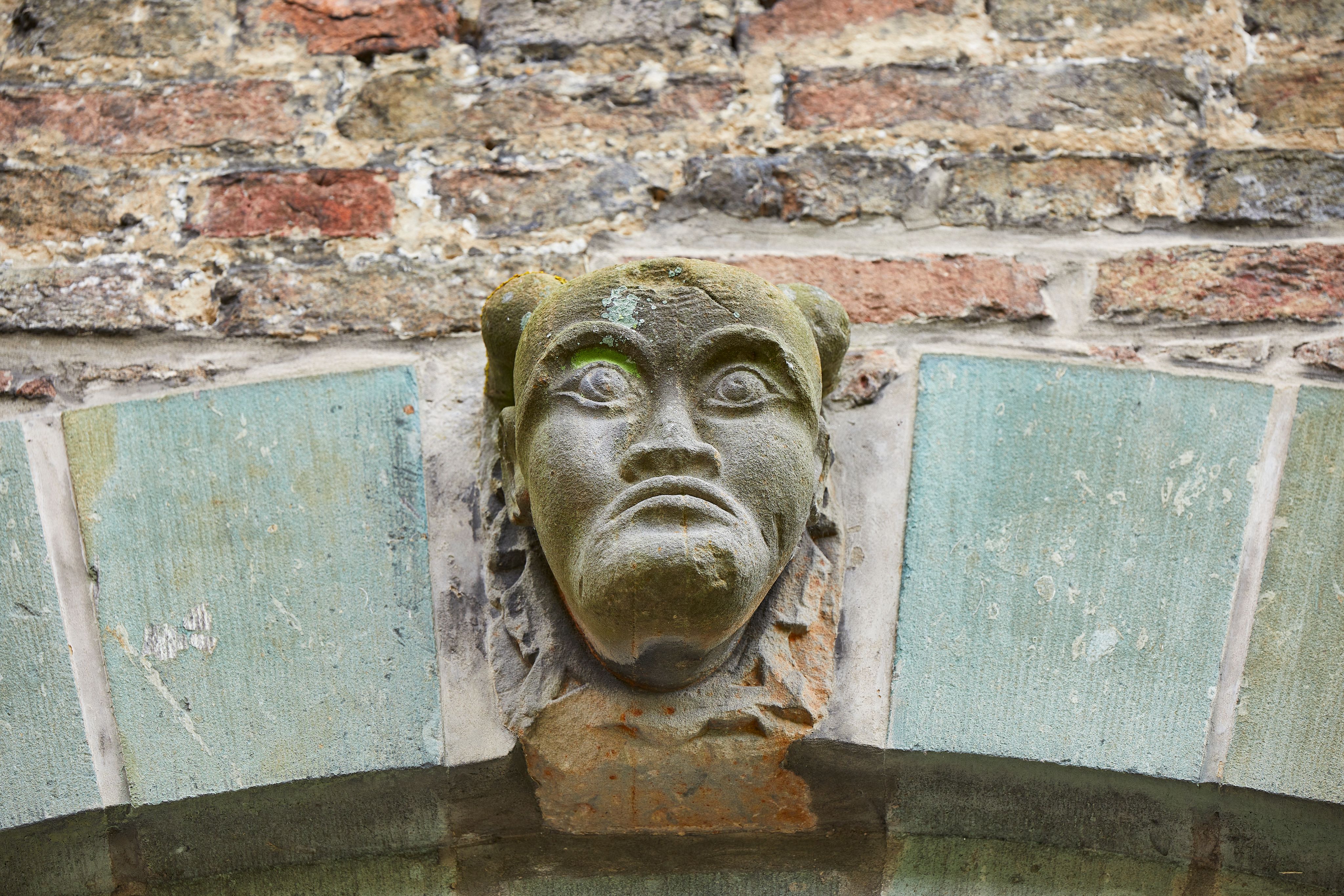 The walls and gates of the House of Assen are decorated with masks, lion heads, coats of arms and inscriptions