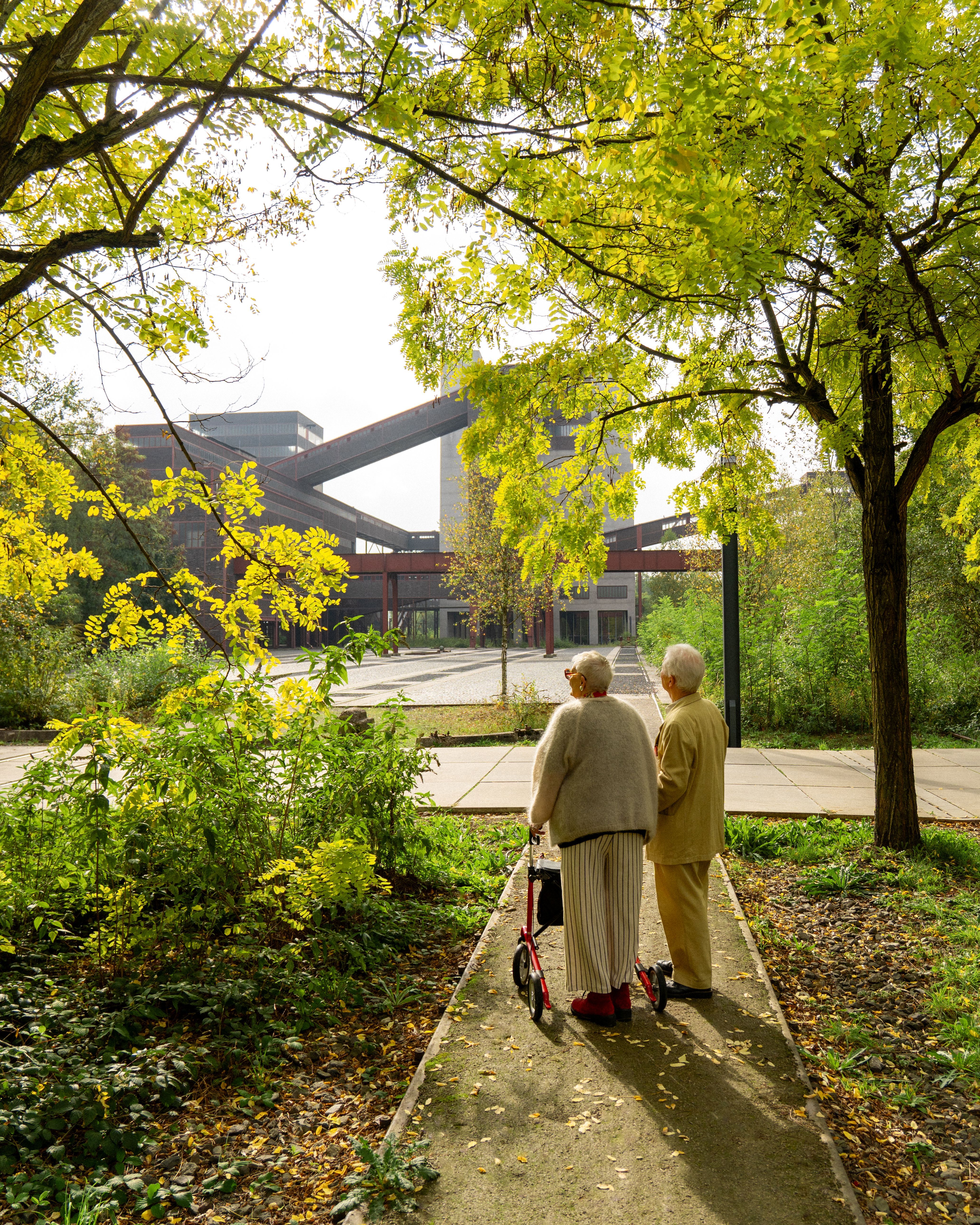An elderly couple takes a look at the Zollverein Coal Mine Industrial Complex in Essen