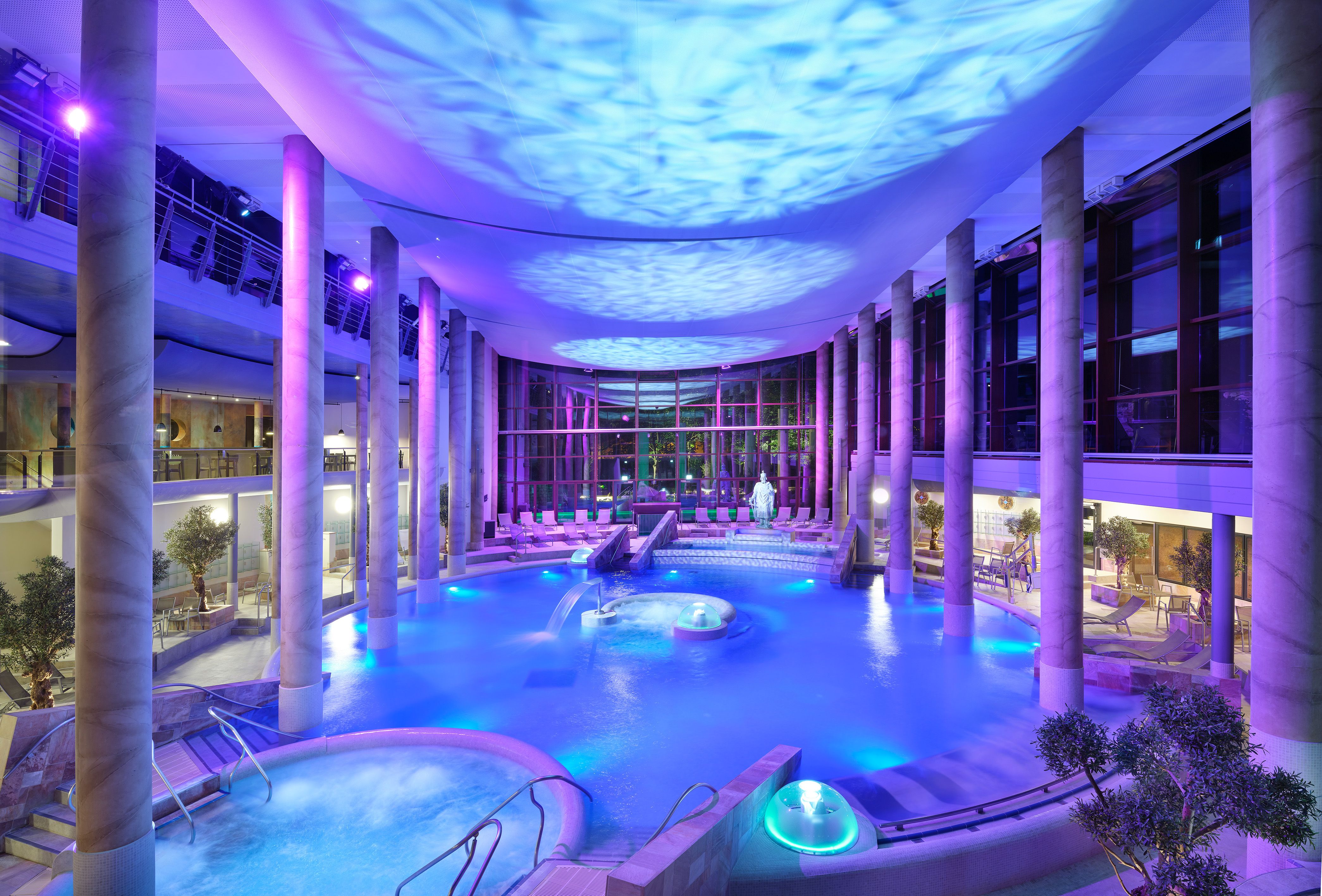 The Carolus Thermal Baths with illuminated pool and columns.